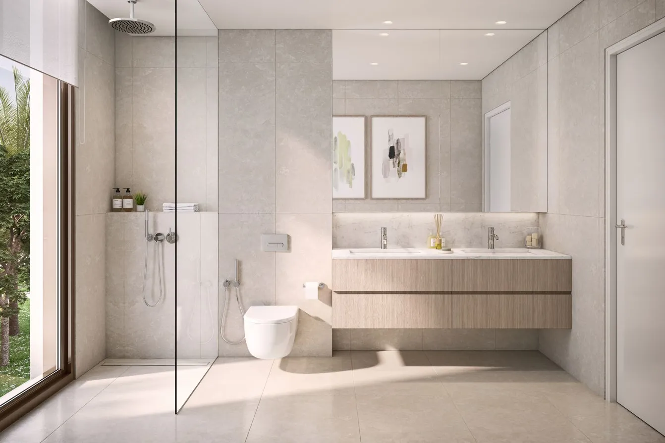 Stone-toned master bathroom with walk-in shower and double vanity