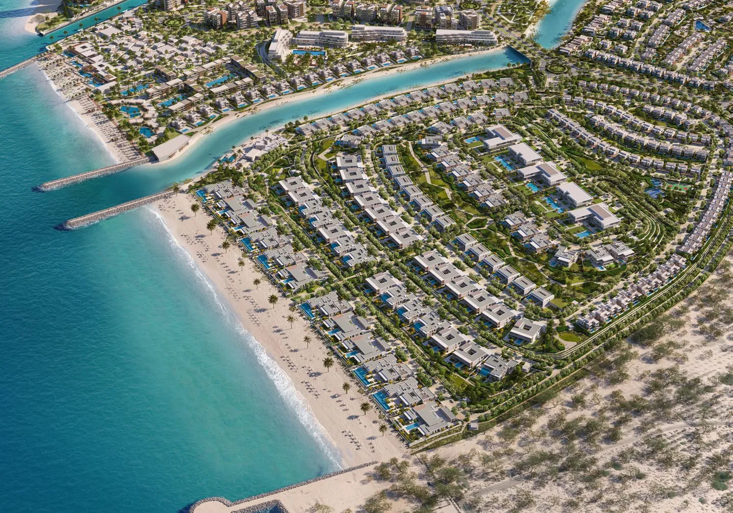 Aerial view of the beachfront villa community beside a canal and the sea